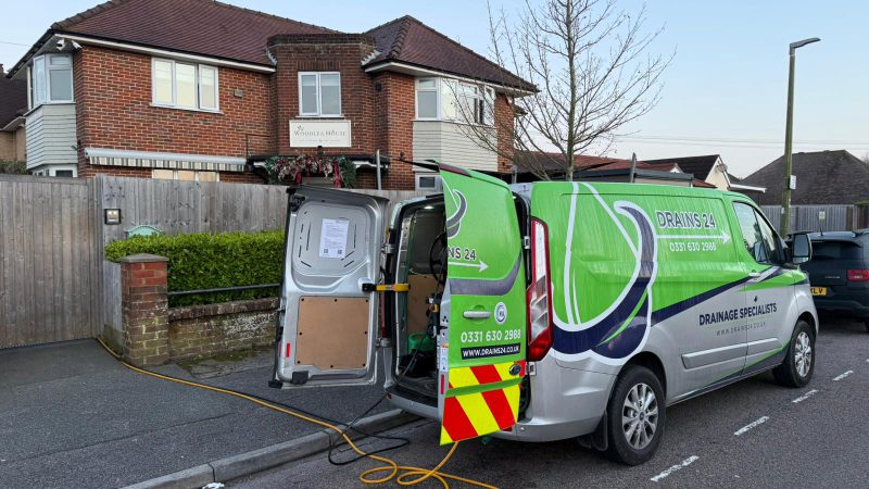 Portsmouth property exterior with damp paving, external gully, inspection chamber and drainage equipment showing coastal drain problems.